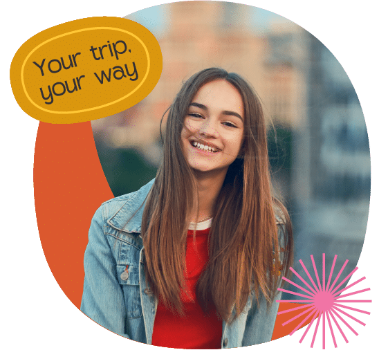 A person in a red beanie and scarf looks up and smiles whilst standing on a bridge. Text reads "Your trip your way" in a yellow shape.