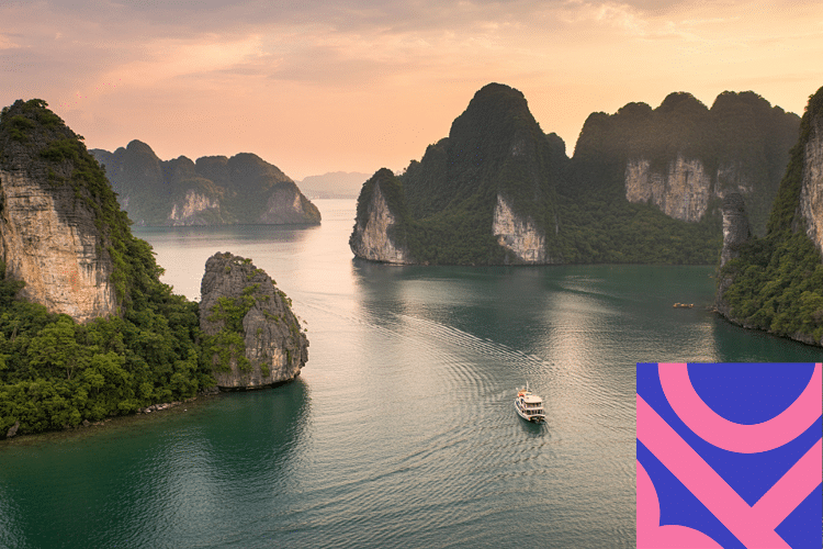 A boat sails through calm waters surrounded by rocky, green islands at sunset; a pink and blue geometric graphic is in the bottom right-hand corner.