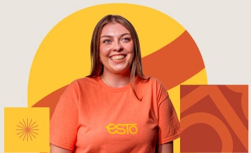 A woman wearing an orange “ESTO” T-shirt smiles in front of a geometric yellow and orange background.