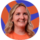 Smiling woman with blonde hair wearing an orange shirt, in front of a blue and orange abstract background.