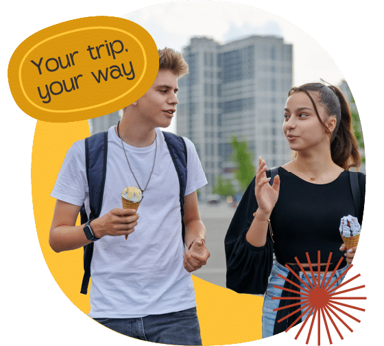 Two young people walk outdoors in Iceland, holding ice cream cones and talking. A graphic overlay reads, "Your trip, your way." Buildings are visible in the blurred background—perfect for inspiring unforgettable science trips.