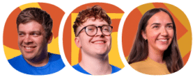 Three people, two wearing blue shirts and one in a yellow shirt, smiling in front of abstract orange and yellow backgrounds.